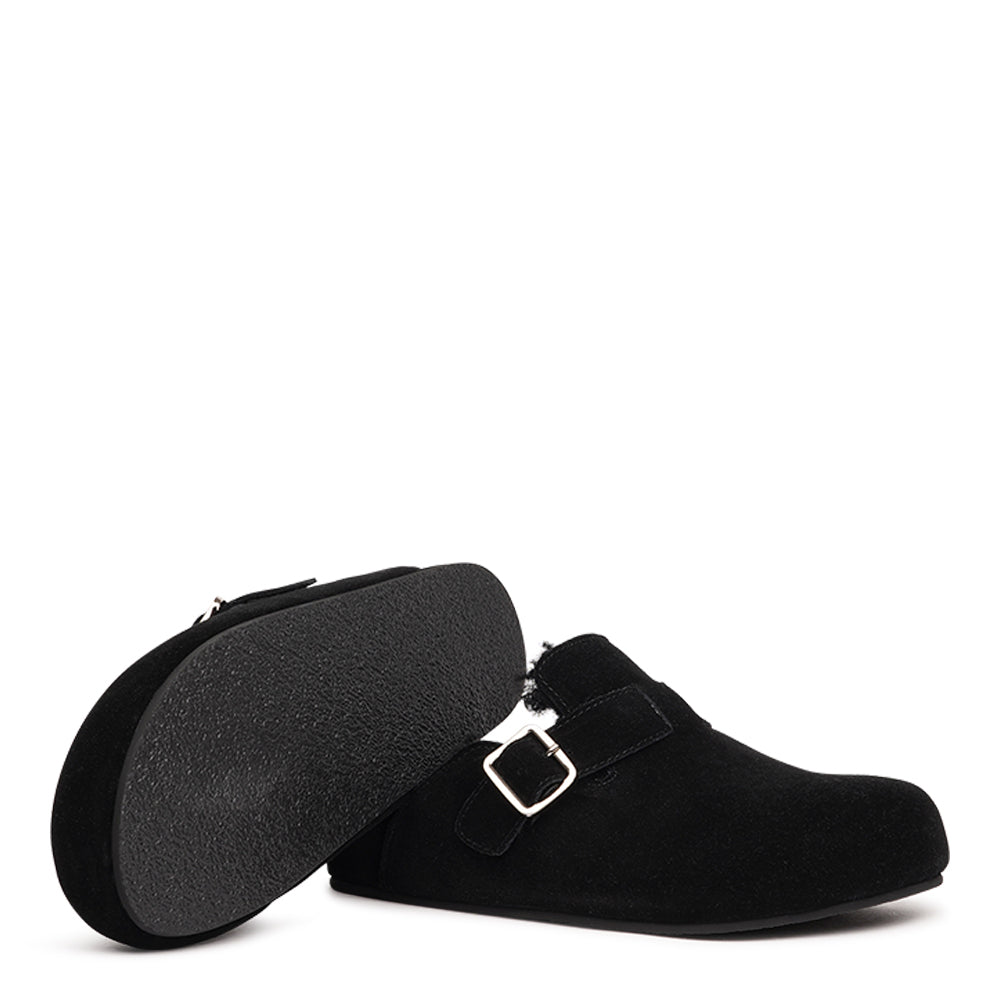 The Nesso Suede Mules are the epitome of luxurious comfort and style. Crafted with a premium suede upper, these exclusive mules feature an adjustable buckle for a customized fit. Lined with soft curly shearling, they provide warmth and a cozy feel, perfect for cooler days.
The durable rubber sole ensures long-lasting wear and excellent traction, making them a practical yet indulgent choice. With their elegant design and plush materials, the Nesso Suede Mules effortlessly blend functionality with fash