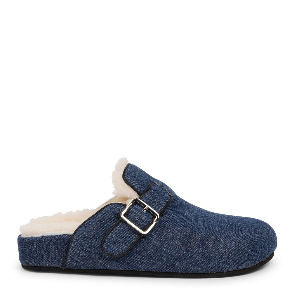 Lovelies Studio - The Nesso Denim Mules are the epitome of luxurious comfort and style. Crafted with a beautiful denim upper, these exclusive mules feature an adjustable buckle for a customized fit. Lined with soft curly shearling, they provide warmth and a cozy feel, perfect for cooler days.
The durable rubber sole ensures long-lasting wear and excellent traction, making them a practical yet indulgent choice. With their elegant design and plush materials, the Nesso Denim Mules effortlessly blend fun