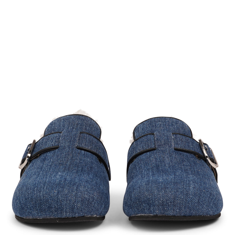 Lovelies Studio - The Nesso Denim Mules are the epitome of luxurious comfort and style. Crafted with a beautiful denim upper, these exclusive mules feature an adjustable buckle for a customized fit. Lined with soft curly shearling, they provide warmth and a cozy feel, perfect for cooler days.
The durable rubber sole ensures long-lasting wear and excellent traction, making them a practical yet indulgent choice. With their elegant design and plush materials, the Nesso Denim Mules effortlessly blend fun
