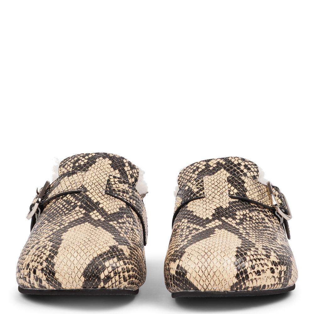 Lovelies Studio - The Nesso Snake Mules are the epitome of luxurious comfort and style. Crafted with a premium leather upper, these exclusive mules feature an adjustable buckle for a customized fit. Lined with soft curly shearling, they provide warmth and a cozy feel, perfect for cooler days.
