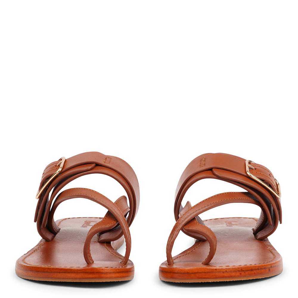 Meet Olio, our expertly handcrafted leather sandal that blends feminine charm with all-day wearability. Designed with a single adjustable buckle, it offers a secure, tailored fit that adapts effortlessly to your lifestyle.
Crafted from vegetable-tanned buffalo leather, the straps are soft, durable, and built to last. Finished with a leather sole and rubber grip, Olio ensures stability and comfort with every step—perfect for both relaxed days and dressed-up moments.