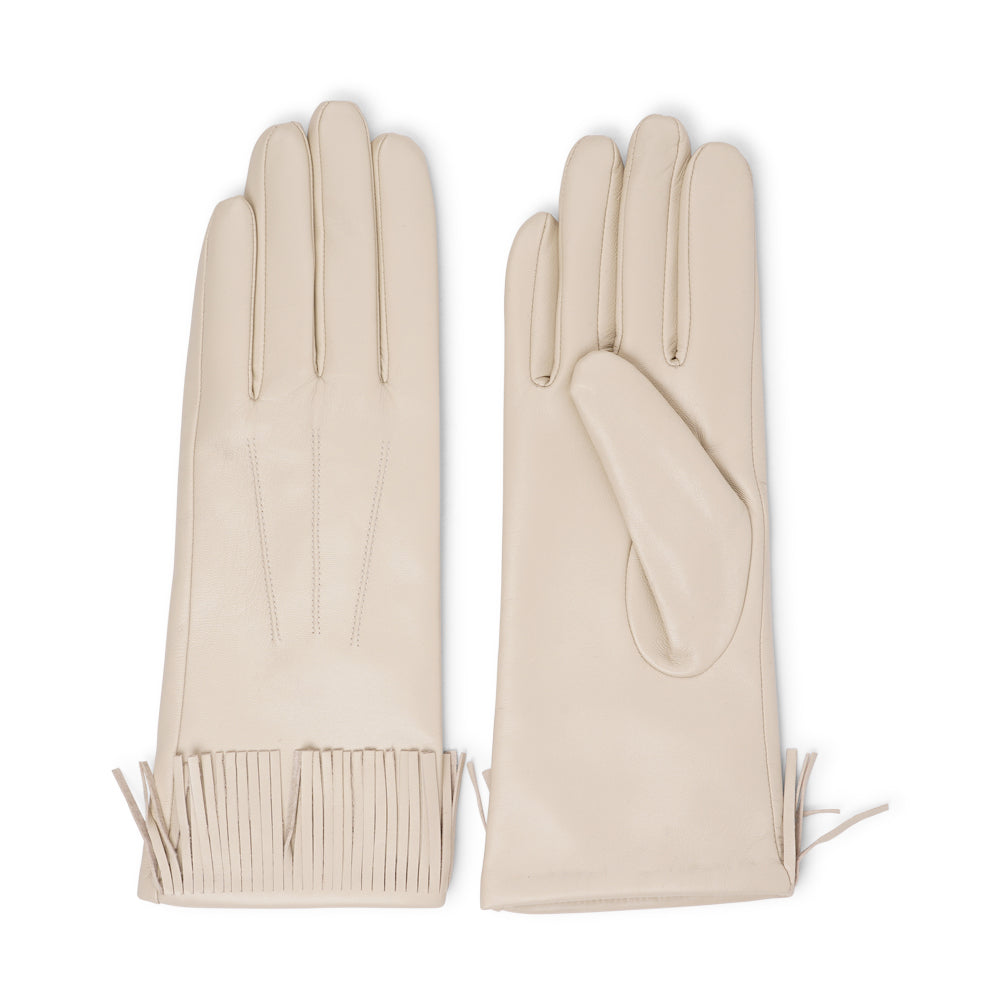 Lovelies Studio - The Pordenone gloves offer a perfect blend of bold style and luxurious comfort. Crafted from premium leather, they feature eye-catching fringe detailing for a unique look.
Lined with soft cashmere, these gloves ensure warmth and elegance, making them a standout accessory for the colder months.