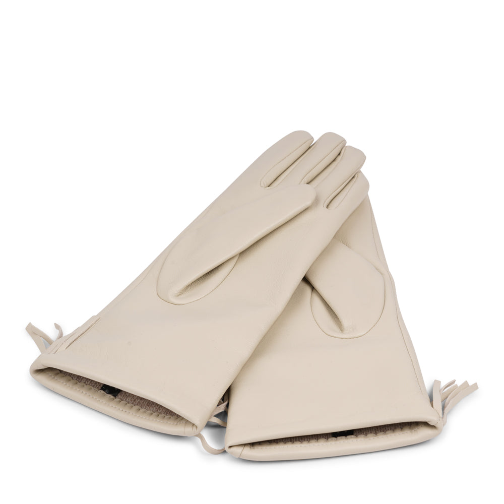 Lovelies Studio - The Pordenone gloves offer a perfect blend of bold style and luxurious comfort. Crafted from premium leather, they feature eye-catching fringe detailing for a unique look.
Lined with soft cashmere, these gloves ensure warmth and elegance, making them a standout accessory for the colder months.