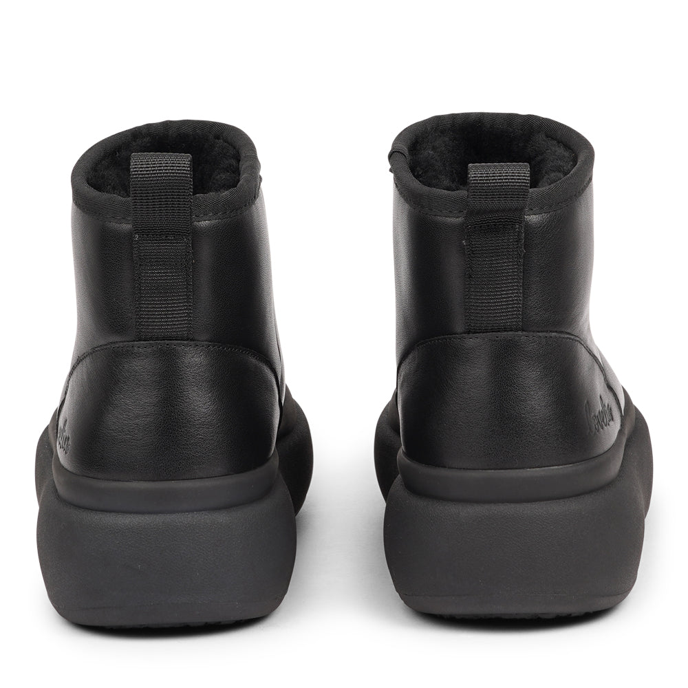 Step into autumn with the luxurious comfort of the Premana Mid-High Shearling Boots!
Crafted with plush shearling lining, these boots envelop your feet in warmth and softness, making them your go-to choice for chilly days. The durable rubber soles provide excellent traction, ensuring stability and support on any terrain.