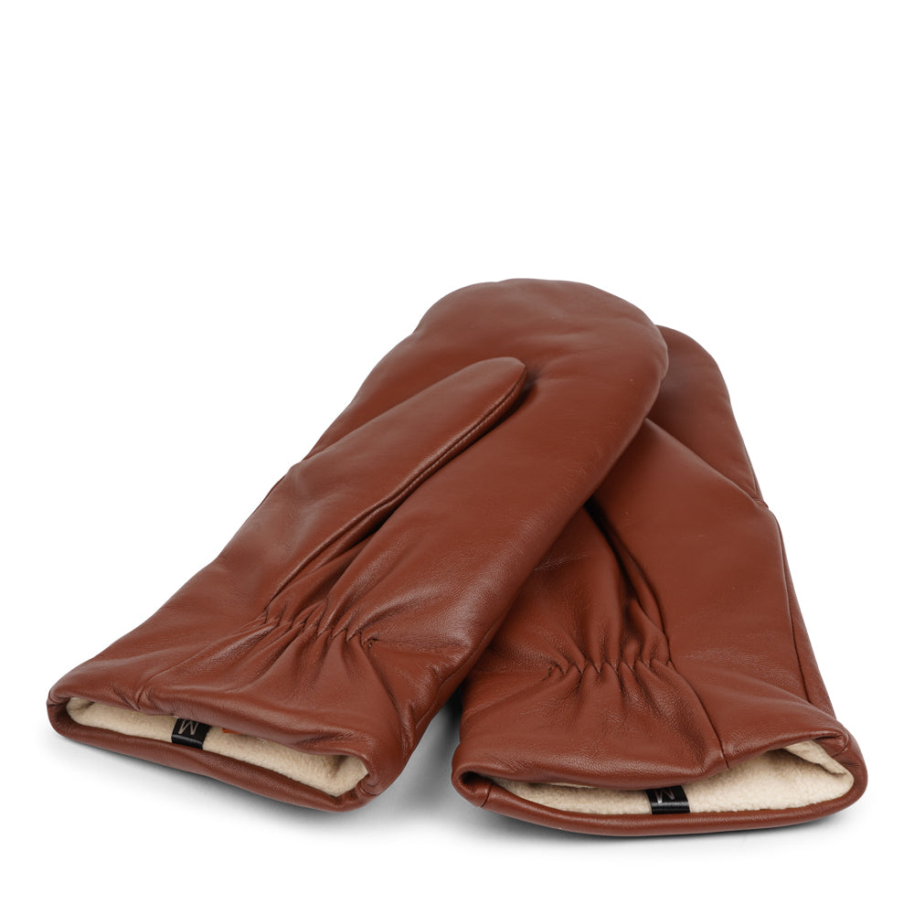 The Ravenna mittens are crafted from premium leather and feature a plush fleece lining for exceptional warmth and comfort.
With their sophisticated design and luxurious materials, these mittens offer both style and practicality, making them an essential accessory for chilly weather.