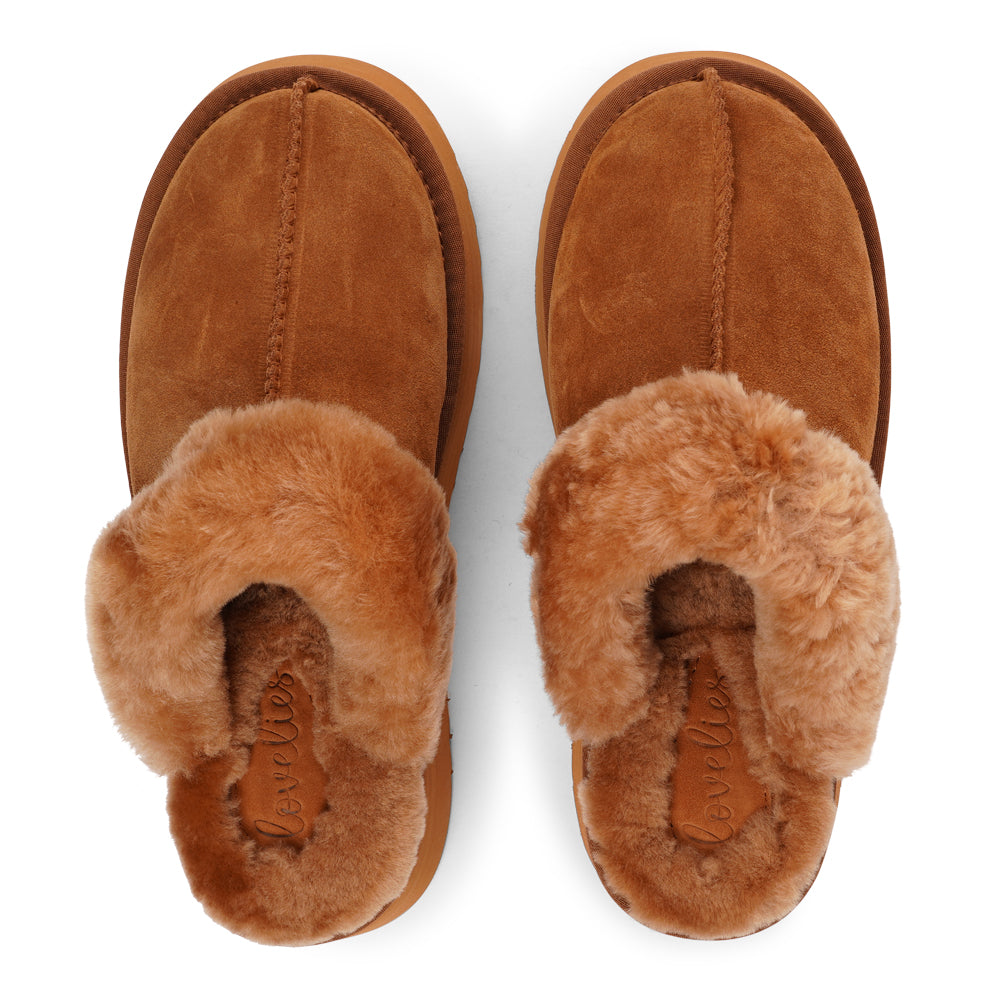 Lovelies - What sets the Robson mules apart is their plush shearling lining, which envelops your feet in a cloud-like cocoon of comfort. The shearling not only adds a touch of opulence but also provides natural insulation, keeping your feet toasty even on the chilliest of days.  But comfort isn't just skin-deep with the Robson mules. The combination of premium suede and the resilient rubber sole ensures durability and longevity, making these mules a dependable choice for daily wear.