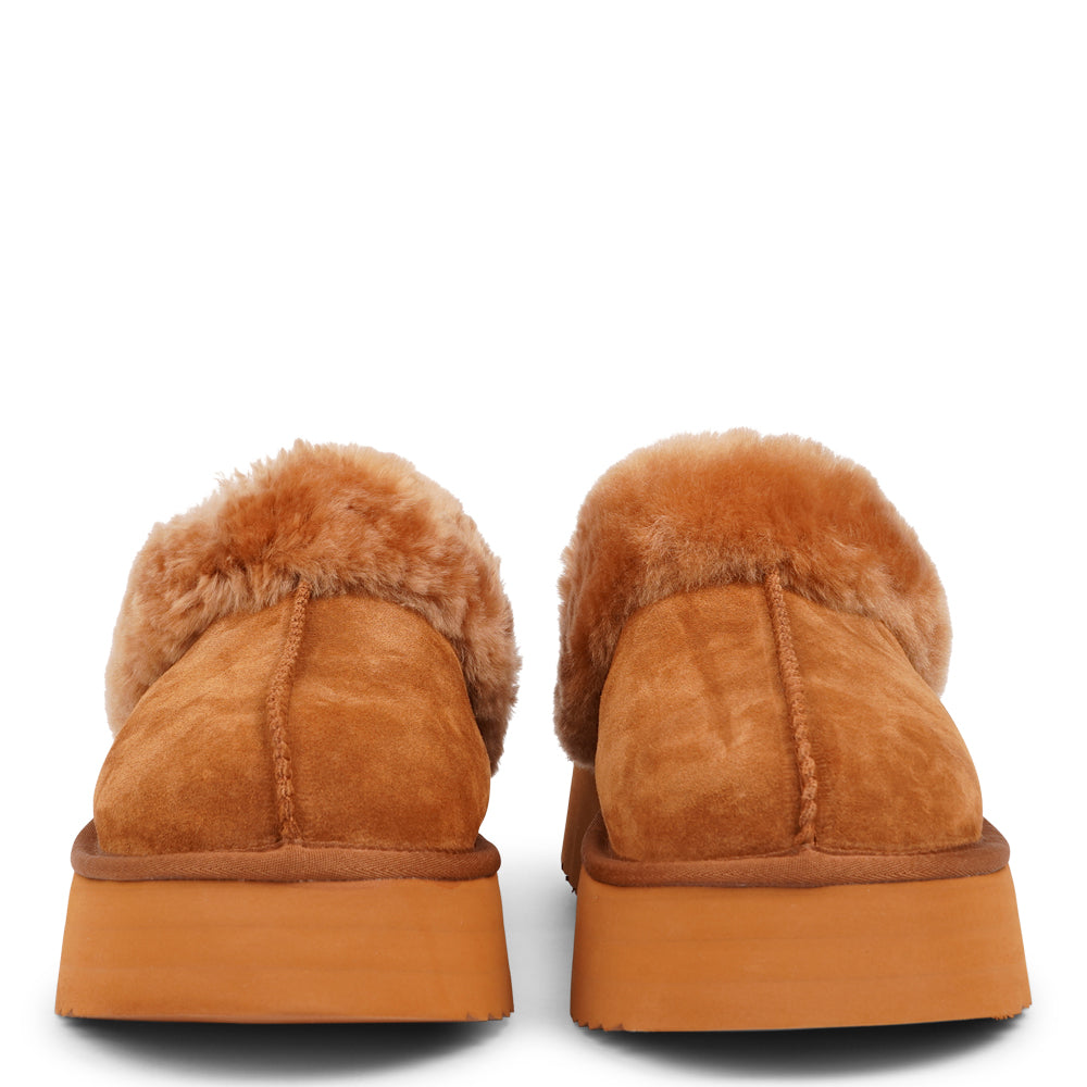 Lovelies - What sets the Robson mules apart is their plush shearling lining, which envelops your feet in a cloud-like cocoon of comfort. The shearling not only adds a touch of opulence but also provides natural insulation, keeping your feet toasty even on the chilliest of days.  But comfort isn't just skin-deep with the Robson mules. The combination of premium suede and the resilient rubber sole ensures durability and longevity, making these mules a dependable choice for daily wear.