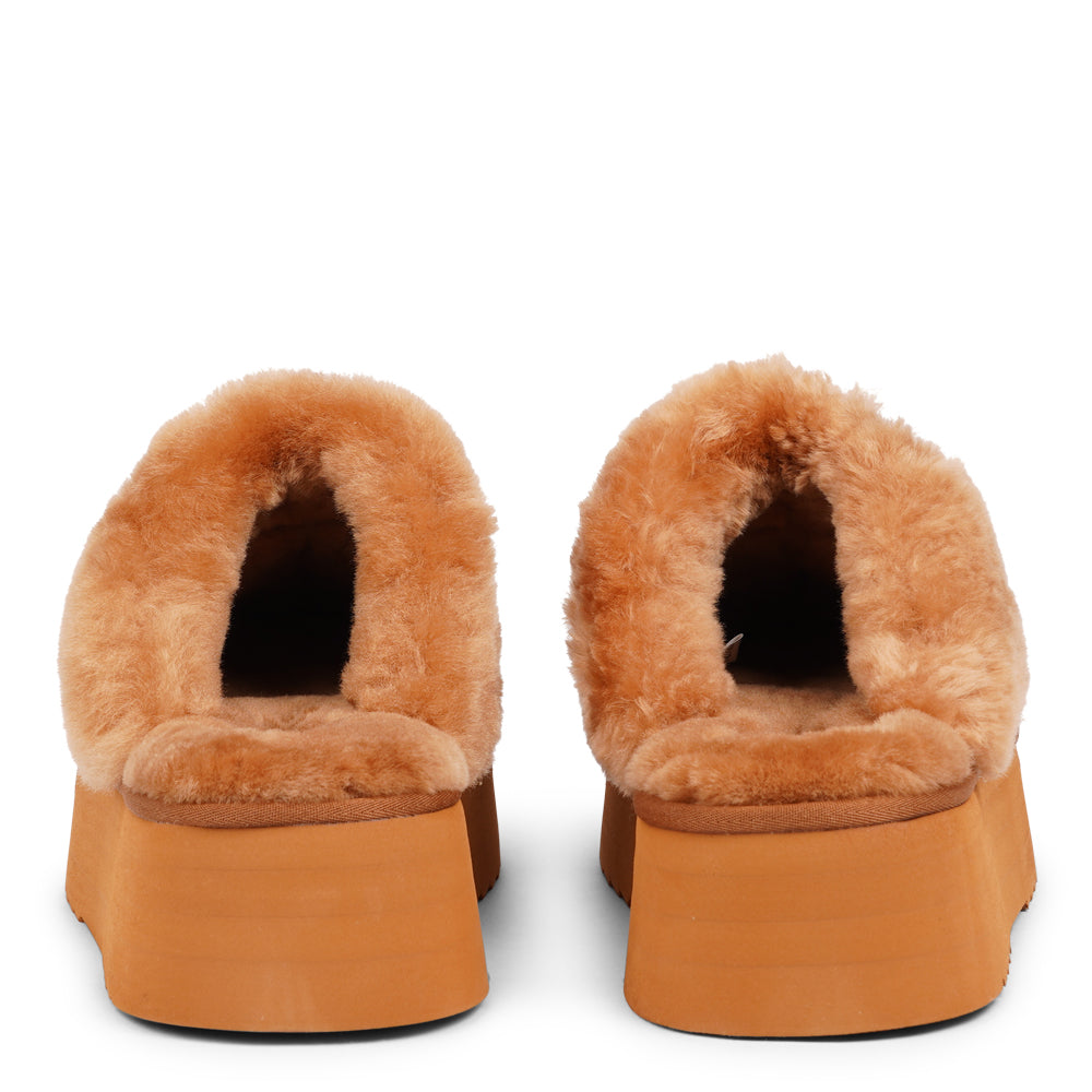 Lovelies - What sets the Robson mules apart is their plush shearling lining, which envelops your feet in a cloud-like cocoon of comfort. The shearling not only adds a touch of opulence but also provides natural insulation, keeping your feet toasty even on the chilliest of days.  But comfort isn't just skin-deep with the Robson mules. The combination of premium suede and the resilient rubber sole ensures durability and longevity, making these mules a dependable choice for daily wear.