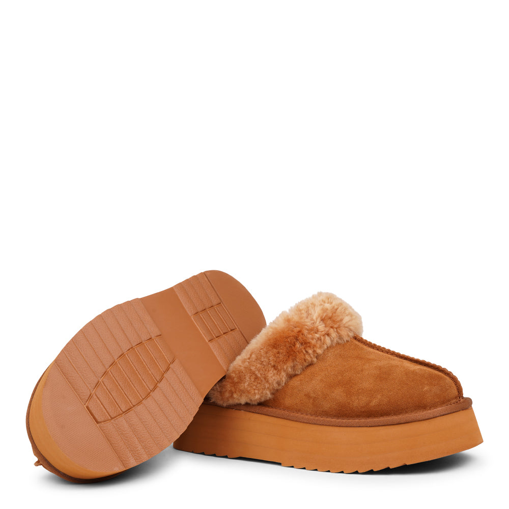 Lovelies - What sets the Robson mules apart is their plush shearling lining, which envelops your feet in a cloud-like cocoon of comfort. The shearling not only adds a touch of opulence but also provides natural insulation, keeping your feet toasty even on the chilliest of days.  But comfort isn't just skin-deep with the Robson mules. The combination of premium suede and the resilient rubber sole ensures durability and longevity, making these mules a dependable choice for daily wear.