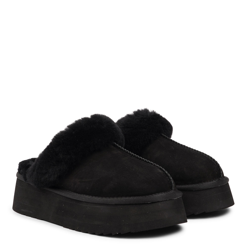 Lovelies - What sets the Robson mules apart is their plush shearling lining, which envelops your feet in a cloud-like cocoon of comfort. The shearling not only adds a touch of opulence but also provides natural insulation, keeping your feet toasty even on the chilliest of days.
But comfort isn't just skin-deep with the Robson mules. The combination of premium nubuck and the resilient rubber sole ensures durability and longevity, making these mules a dependable choice for daily wear.