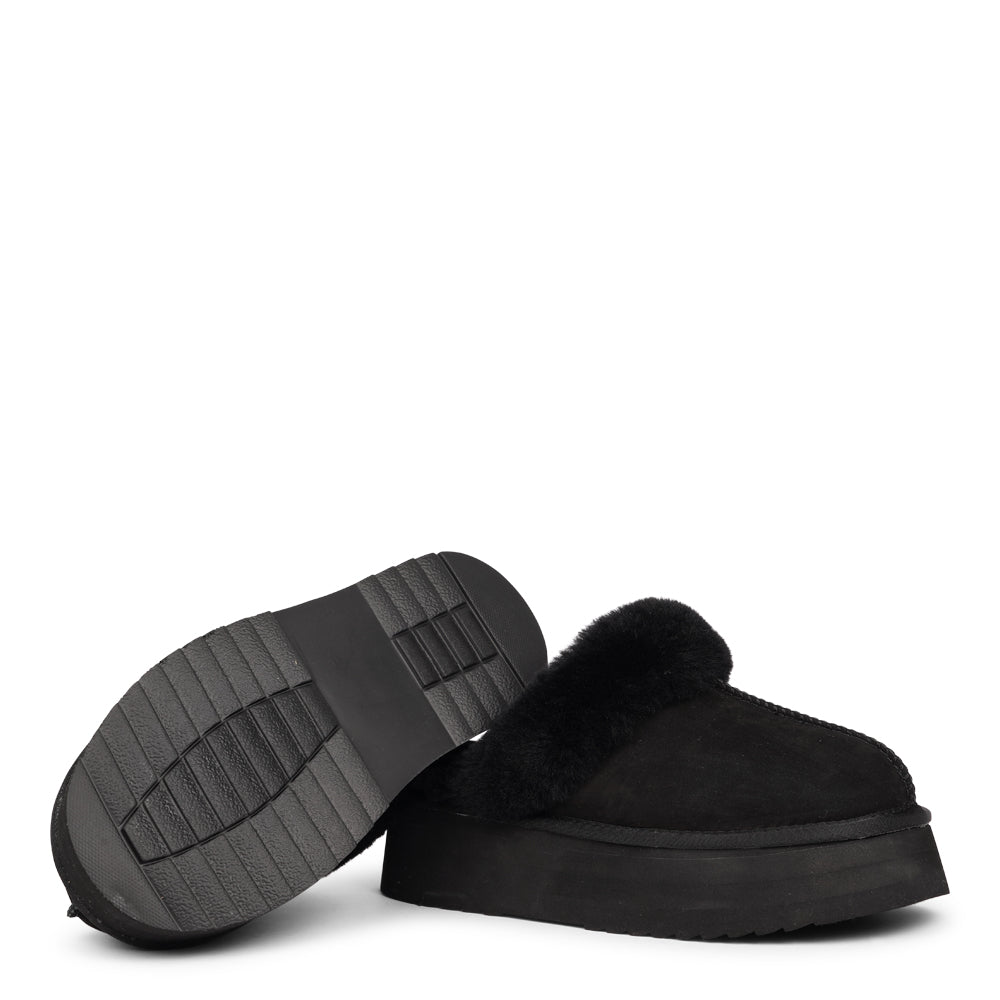 Lovelies - What sets the Robson mules apart is their plush shearling lining, which envelops your feet in a cloud-like cocoon of comfort. The shearling not only adds a touch of opulence but also provides natural insulation, keeping your feet toasty even on the chilliest of days.
But comfort isn't just skin-deep with the Robson mules. The combination of premium nubuck and the resilient rubber sole ensures durability and longevity, making these mules a dependable choice for daily wear.