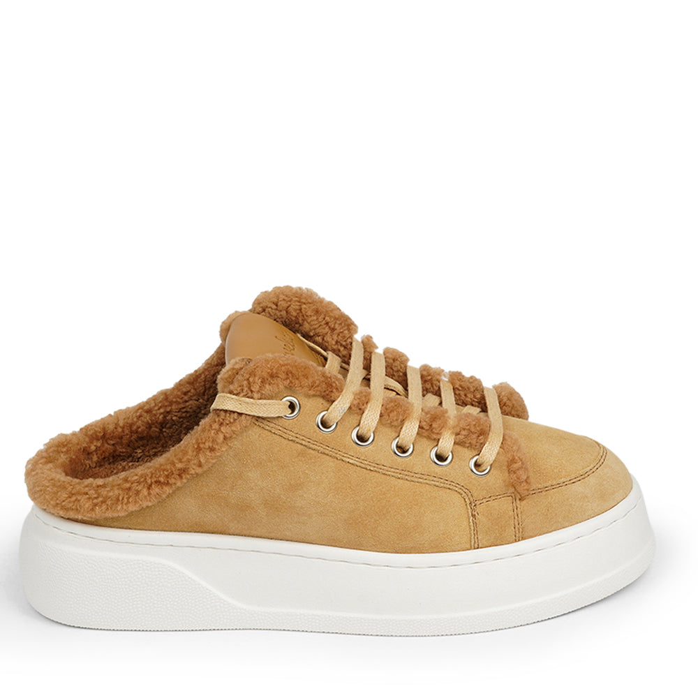 At the foundation of the Selva open sneaker lies a soft yet durable rubber sole, ensuring long-lasting wear and exceptional grip.   The upper is adorned with suede and features charming shearling details, adding a touch of luxury to your every step. Whether you're dressing up for a night out or aiming for a more casual look, these sneakers effortlessly elevate your style.