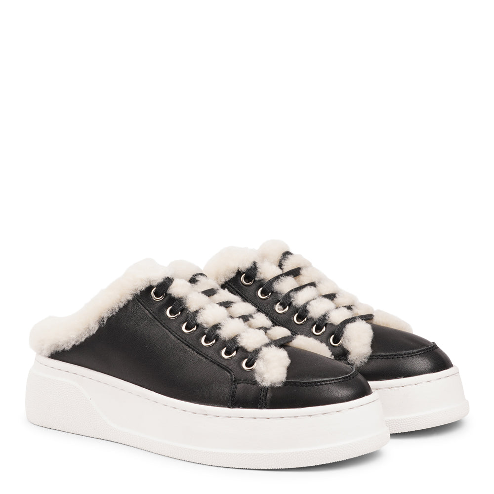 Style Selva from Lovelies. The upper is adorned with suede and features charming shearling details, adding a touch of luxury to your every step. Whether you're dressing up for a night out or aiming for a more casual look, these sneakers effortlessly elevate your style.
With a full innersole and lining of plush shearling, your feet are cocooned in comfort and warmth. This luxurious lining not only keeps you toasty but also molds around your feet, providing a custom fit like no other.