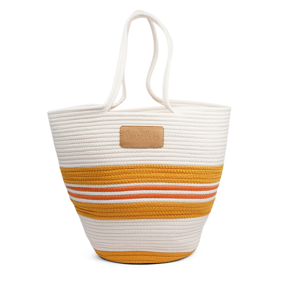 Lovelies Studio - Meet the SILVI beach bag - it's all about simple, laid-back cool. Crafted from sturdy cotton ropes, this bag is built to last and adds a touch of natural charm to your beach essentials. The SILVI keeps it sleek with a clean white top, oozing effortless style. But it's got a playful side too, with a belt of colors and a matching solid color bottom that really makes it stand out.