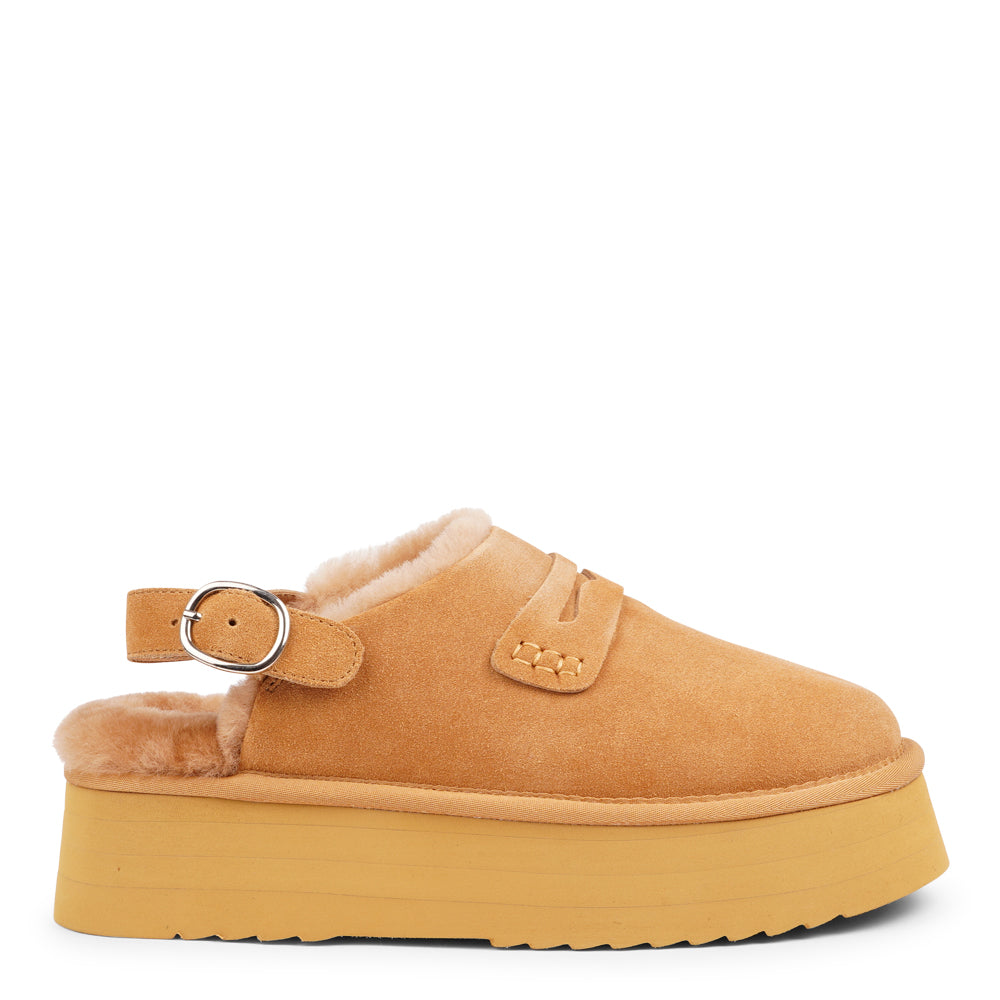 Step into a world of luxury and coziness with our Siple suede mules. Crafted with the finest suede, these mules are designed to provide not only elegance but also ultimate comfort for your feet. The sumptuous shearling lining ensures your feet stay warm and snug, making them the perfect choice for colder days.  The standout feature of the Siple mules is the adjustable heel strap, allowing you to customize the fit to your liking.