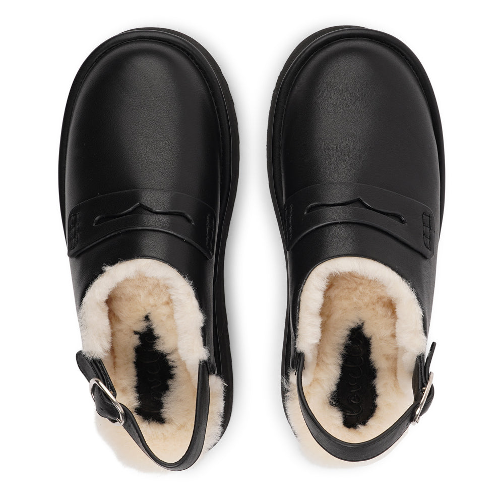 Step into a world of luxury and coziness with our Siple suede mules. Crafted with the finest suede, these mules are designed to provide not only elegance but also ultimate comfort for your feet. The sumptuous shearling lining ensures your feet stay warm and snug, making them the perfect choice for colder days.  The standout feature of the Siple mules is the adjustable heel strap, allowing you to customize the fit to your liking.