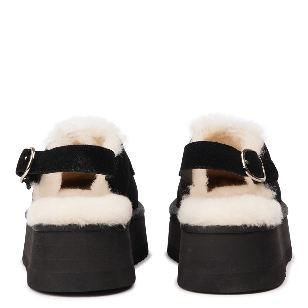 Step into a world of luxury and coziness with our Siple suede mules. Crafted with the finest suede, these mules are designed to provide not only elegance but also ultimate comfort for your feet. The sumptuous shearling lining ensures your feet stay warm and snug, making them the perfect choice for colder days.
The standout feature of the Siple mules is the adjustable heel strap, allowing you to customize the fit to your liking. This ensures a secure and comfortable feel as you walk, no matter where your da