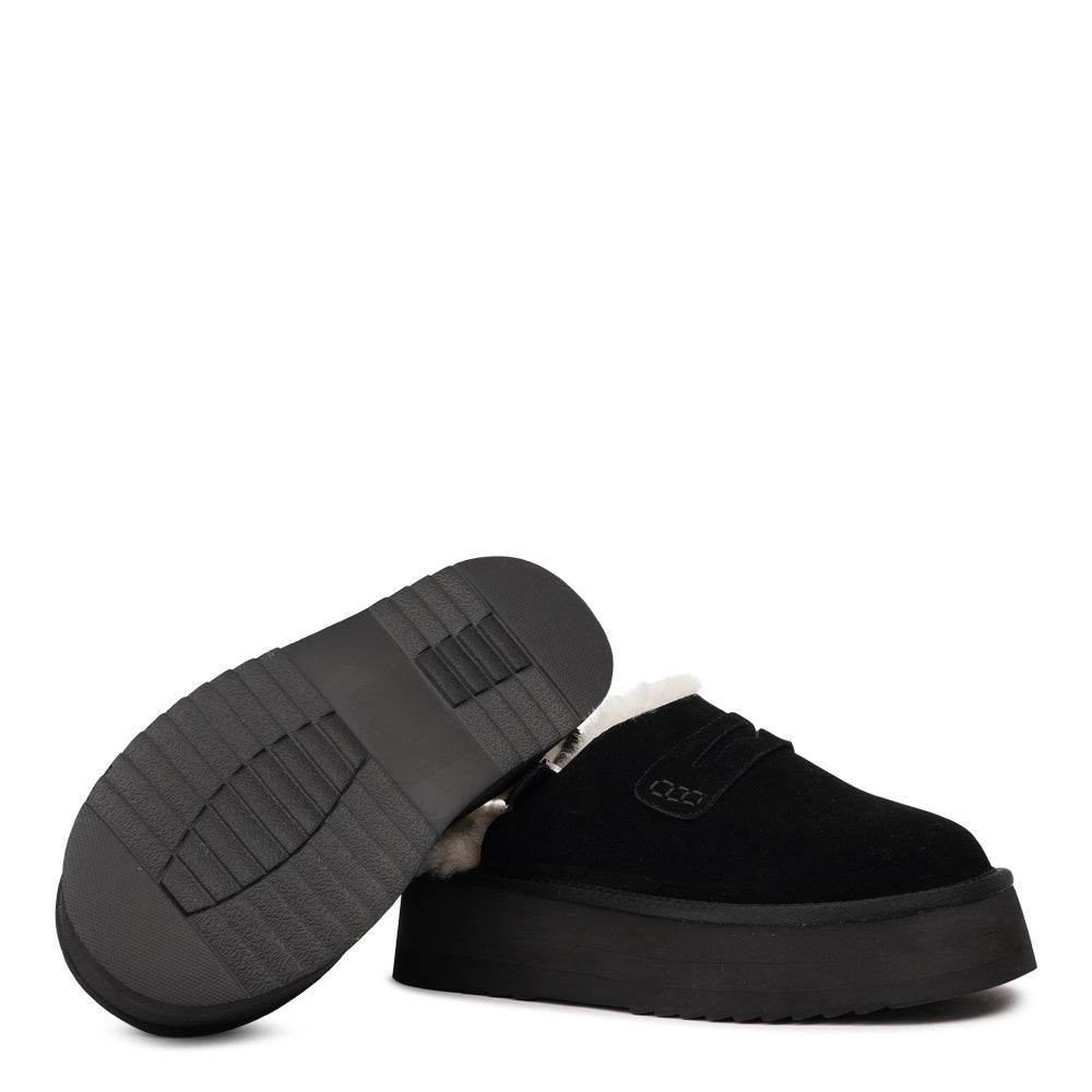 Step into a world of luxury and coziness with our Siple suede mules. Crafted with the finest suede, these mules are designed to provide not only elegance but also ultimate comfort for your feet. The sumptuous shearling lining ensures your feet stay warm and snug, making them the perfect choice for colder days.
The standout feature of the Siple mules is the adjustable heel strap, allowing you to customize the fit to your liking. This ensures a secure and comfortable feel as you walk, no matter where your da