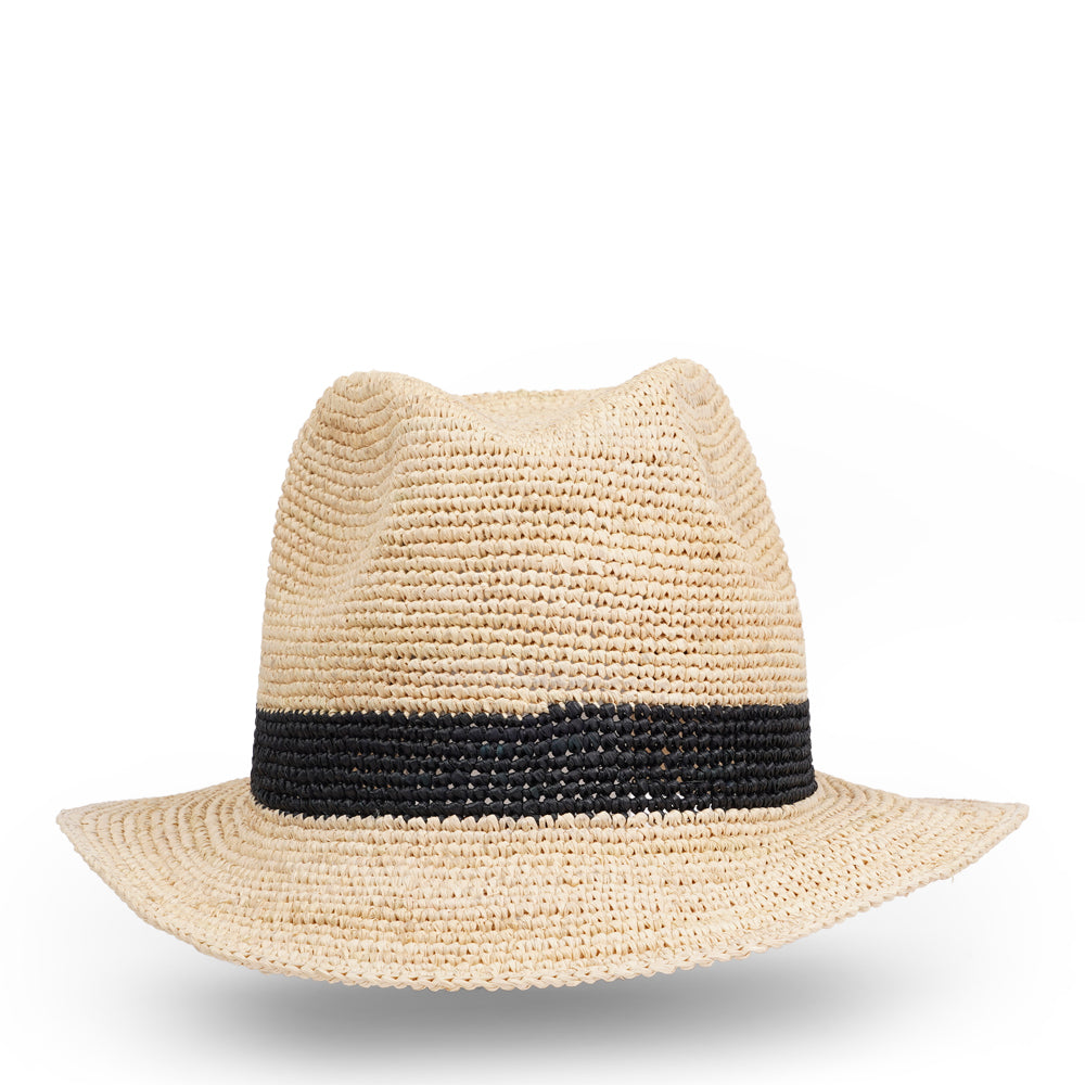 The Summery Viviani hat, a stunning creation meticulously crafted by local artisans in Madagascar exclusively for Lovelies Studio. Each piece is a testament to the skill and dedication of these artisans, who handcraft every detail with precision and care.  Made from raffia, a natural fiber renowned for its durability and flexibility, the Viviani hat is not only stylish but also eco-friendly. The raffia is carefully colored by hand using traditional methods