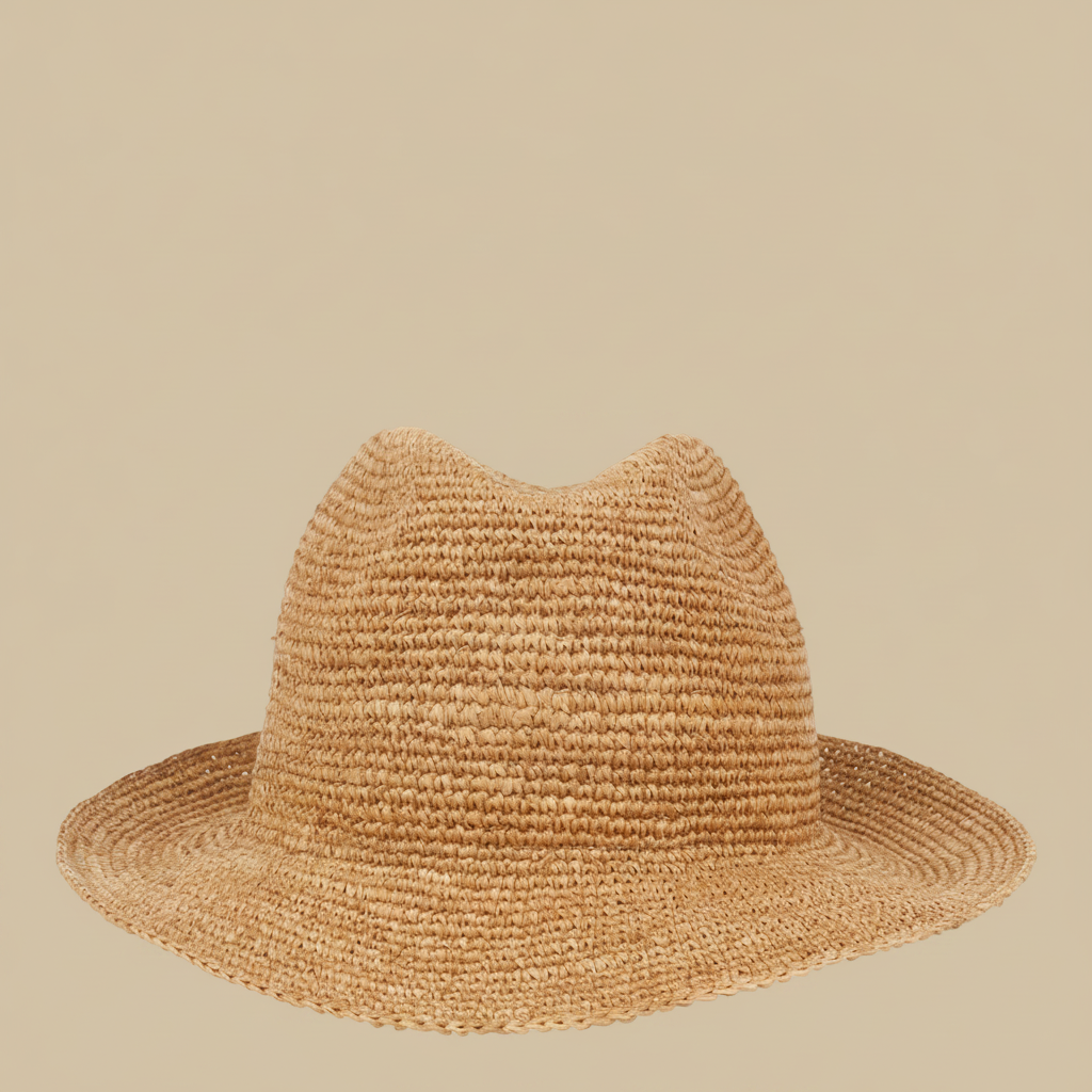 What truly sets the Viviani hat apart is its intricate weaving technique, which transforms the raffia into a timeless fedora silhouette. The result is a beautifully structured hat that effortlessly combines elegance with a touch of rustic charm, perfect for adding a chic flair to any summer ensemble.
With the Summery Viviani hat, you're not just wearing an accessory – you're embracing a piece of artistry and supporting the craftsmanship of local artisans in Madagascar.