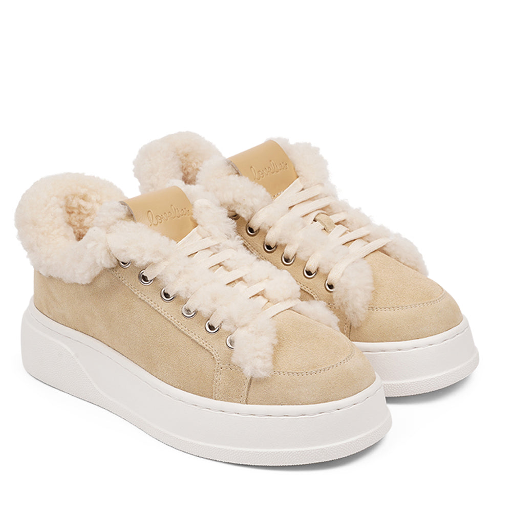 At the foundation of the Zanja low sneaker lies a soft yet durable rubber sole, ensuring long-lasting wear and exceptional grip.   The upper is adorned with suede and features charming shearling details, adding a touch of luxury to your every step. Whether you're dressing up for a night out or aiming for a more casual look, these sneakers effortlessly elevate your style.