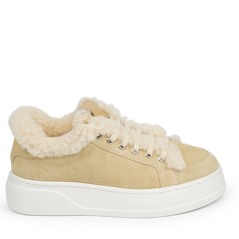 At the foundation of the Zanja low sneaker lies a soft yet durable rubber sole, ensuring long-lasting wear and exceptional grip. The upper is adorned with suede and features charming shearling details, adding a touch of luxury to your every step. Whether you're dressing up for a night out or aiming for a more casual look, these sneakers effortlessly elevate your style.