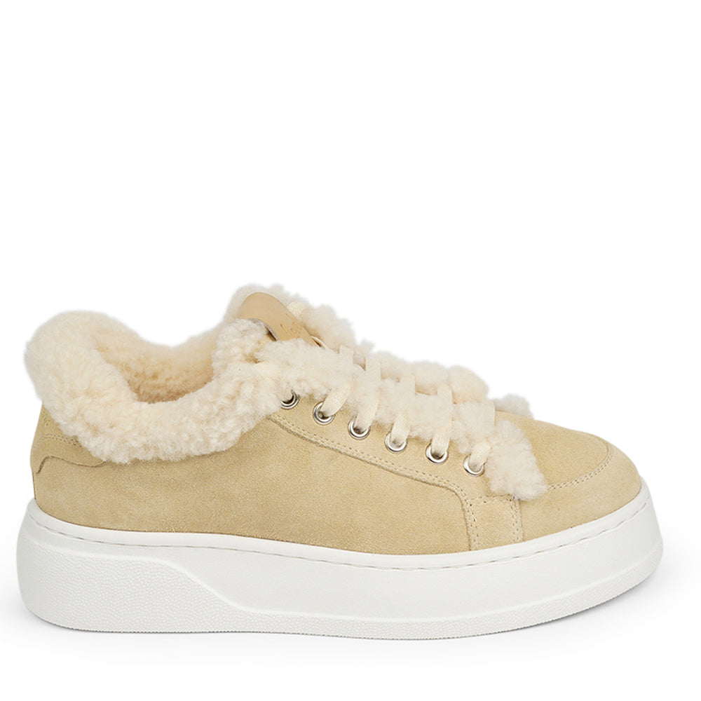 At the foundation of the Zanja low sneaker lies a soft yet durable rubber sole, ensuring long-lasting wear and exceptional grip.   The upper is adorned with suede and features charming shearling details, adding a touch of luxury to your every step. Whether you're dressing up for a night out or aiming for a more casual look, these sneakers effortlessly elevate your style.