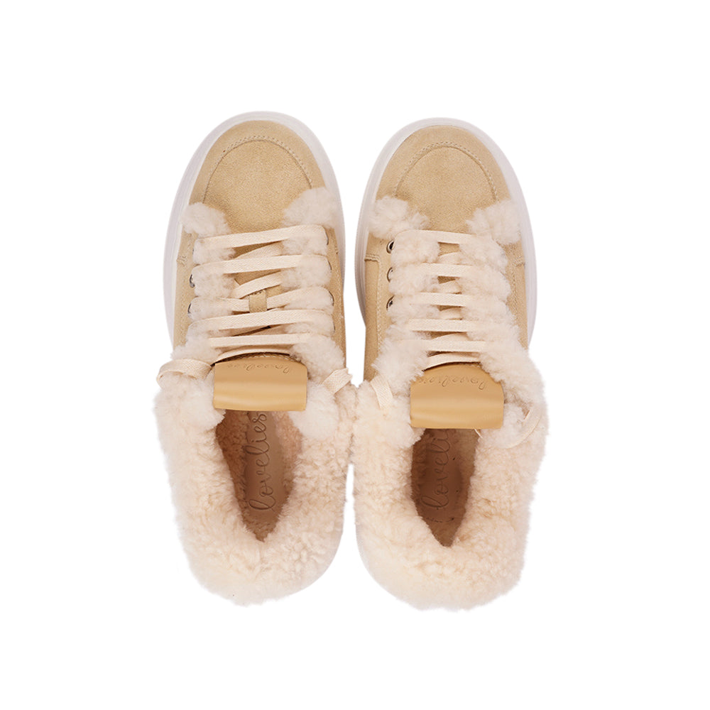 At the foundation of the Zanja low sneaker lies a soft yet durable rubber sole, ensuring long-lasting wear and exceptional grip. The upper is adorned with suede and features charming shearling details, adding a touch of luxury to your every step. Whether you're dressing up for a night out or aiming for a more casual look, these sneakers effortlessly elevate your style.