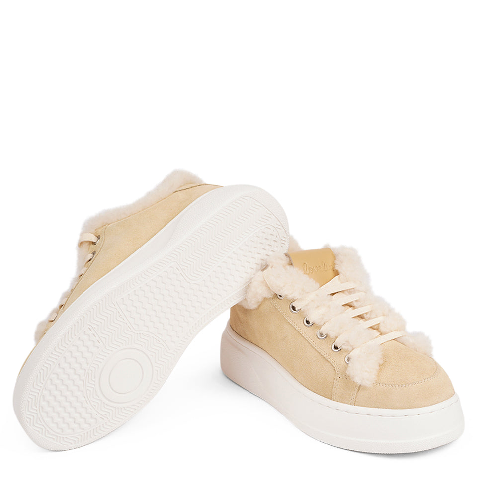 At the foundation of the Zanja low sneaker lies a soft yet durable rubber sole, ensuring long-lasting wear and exceptional grip. The upper is adorned with suede and features charming shearling details, adding a touch of luxury to your every step. Whether you're dressing up for a night out or aiming for a more casual look, these sneakers effortlessly elevate your style.