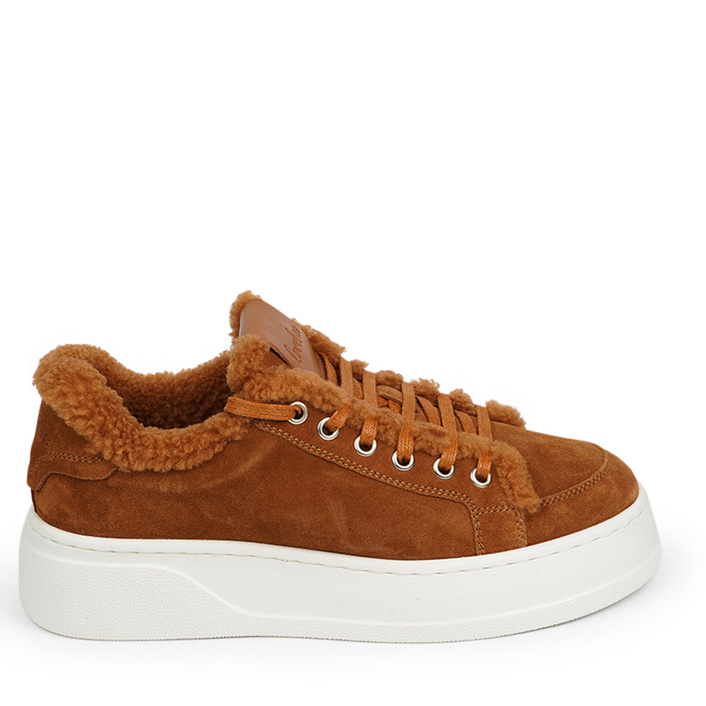 At the foundation of the Zanja low sneaker lies a soft yet durable rubber sole, ensuring long-lasting wear and exceptional grip.   The upper is adorned with suede and features charming shearling details, adding a touch of luxury to your every step. Whether you're dressing up for a night out or aiming for a more casual look, these sneakers effortlessly elevate your style.