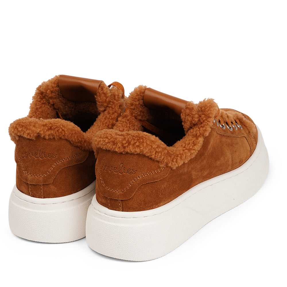 At the foundation of the Zanja low sneaker lies a soft yet durable rubber sole, ensuring long-lasting wear and exceptional grip. The upper is adorned with suede and features charming shearling details, adding a touch of luxury to your every step. Whether you're dressing up for a night out or aiming for a more casual look, these sneakers effortlessly elevate your style.
