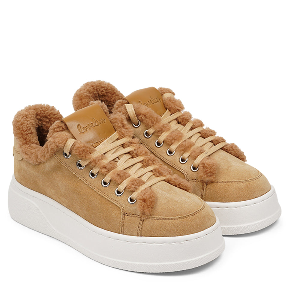 At the foundation of the Zanja low sneaker lies a soft yet durable rubber sole, ensuring long-lasting wear and exceptional grip.   The upper is adorned with suede and features charming shearling details, adding a touch of luxury to your every step. Whether you're dressing up for a night out or aiming for a more casual look, these sneakers effortlessly elevate your style.
