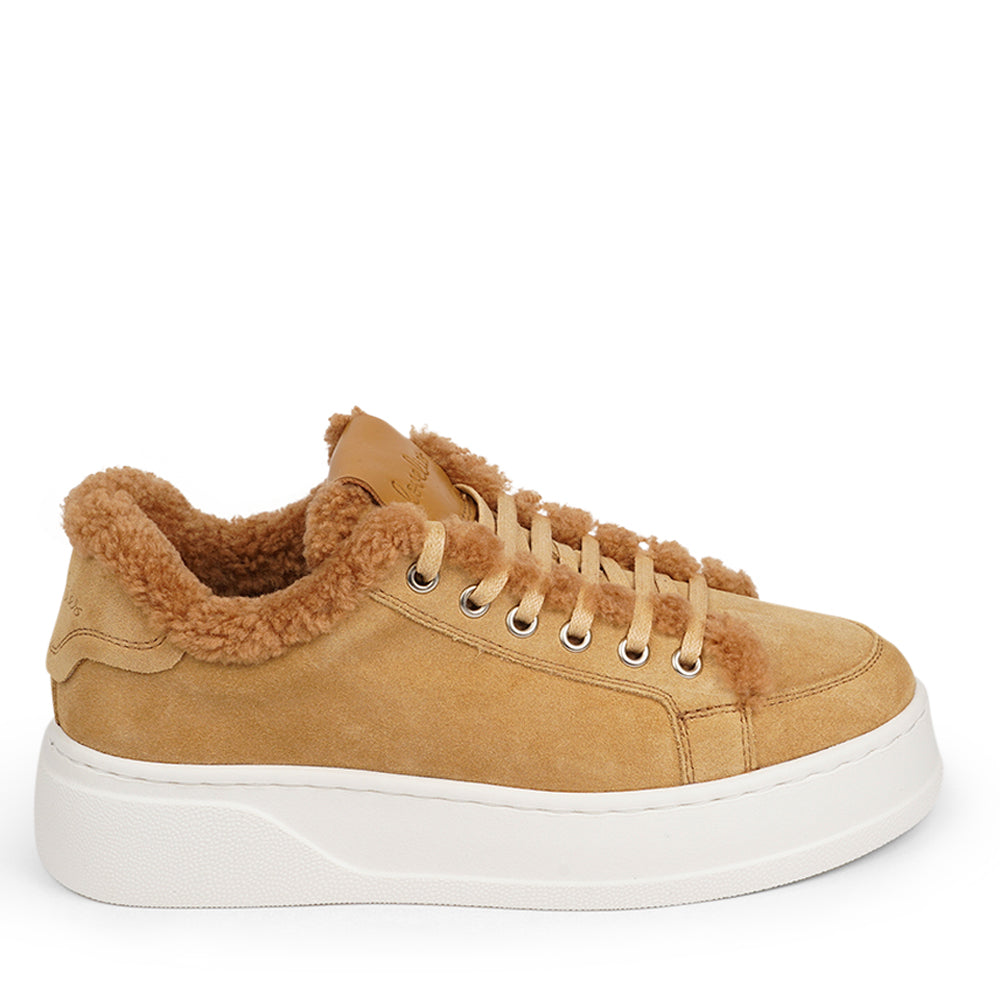 At the foundation of the Zanja low sneaker lies a soft yet durable rubber sole, ensuring long-lasting wear and exceptional grip.   The upper is adorned with suede and features charming shearling details, adding a touch of luxury to your every step. Whether you're dressing up for a night out or aiming for a more casual look, these sneakers effortlessly elevate your style.