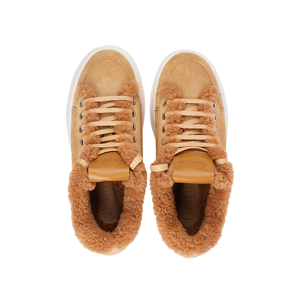 At the foundation of the Zanja low sneaker lies a soft yet durable rubber sole, ensuring long-lasting wear and exceptional grip.   The upper is adorned with suede and features charming shearling details, adding a touch of luxury to your every step. Whether you're dressing up for a night out or aiming for a more casual look, these sneakers effortlessly elevate your style.