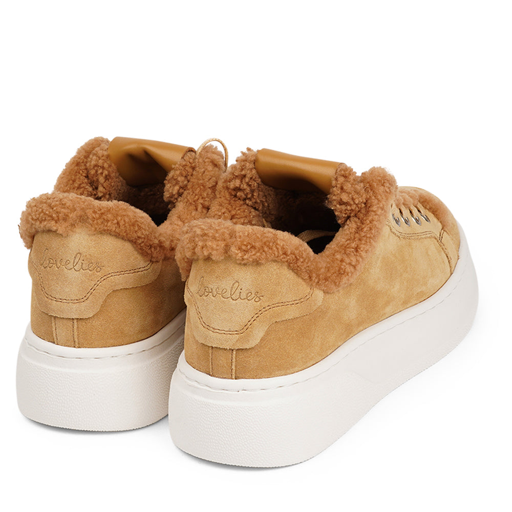 At the foundation of the Zanja low sneaker lies a soft yet durable rubber sole, ensuring long-lasting wear and exceptional grip.   The upper is adorned with suede and features charming shearling details, adding a touch of luxury to your every step. Whether you're dressing up for a night out or aiming for a more casual look, these sneakers effortlessly elevate your style.