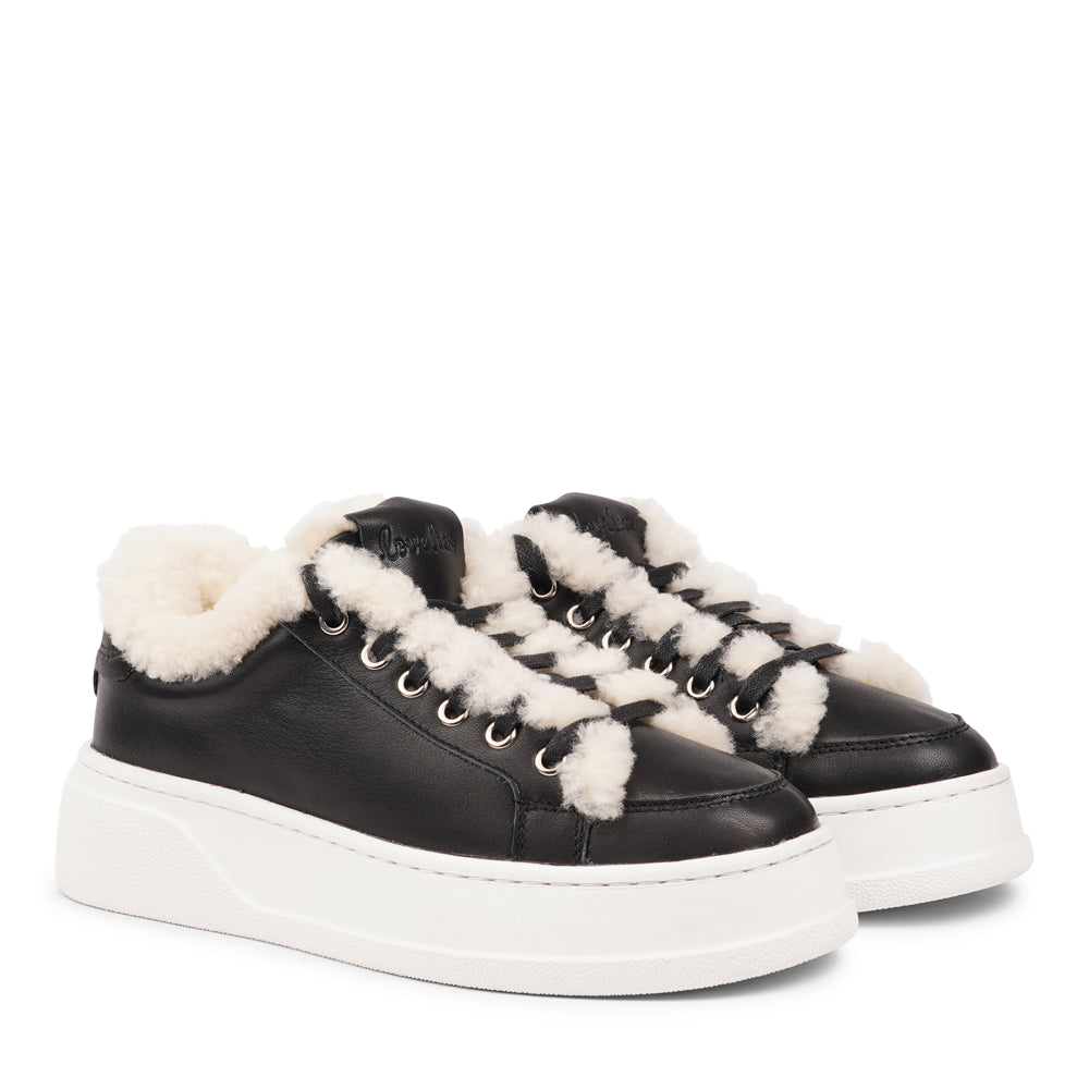 Lovelies Studio Elevate your sneaker game with the Zanja low sneaker, a true embodiment of comfort and style. Crafted to keep you not only fashion-forward but also snug and cozy.
At the foundation of the Zanja low sneaker lies a soft yet durable rubber sole, ensuring long-lasting wear and exceptional grip.
The upper is adorned with leather and features charming shearling details, adding a touch of luxury to your every step. Whether you're dressing up for a night out or aiming for a more casual look, these