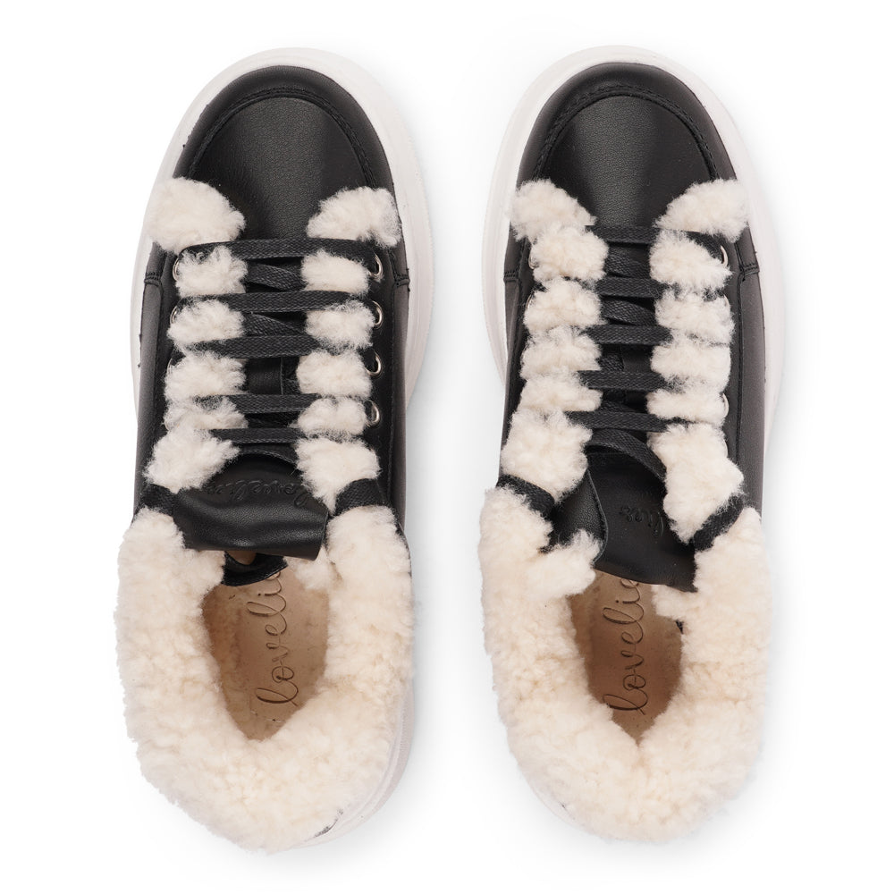 Lovelies Studio Elevate your sneaker game with the Zanja low sneaker, a true embodiment of comfort and style. Crafted to keep you not only fashion-forward but also snug and cozy.
At the foundation of the Zanja low sneaker lies a soft yet durable rubber sole, ensuring long-lasting wear and exceptional grip.
The upper is adorned with leather and features charming shearling details, adding a touch of luxury to your every step. Whether you're dressing up for a night out or aiming for a more casual look, these