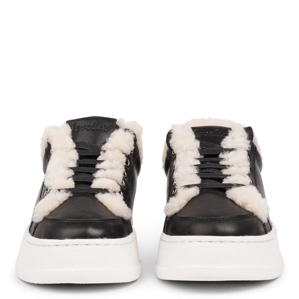 Lovelies Studio Elevate your sneaker game with the Zanja low sneaker, a true embodiment of comfort and style. Crafted to keep you not only fashion-forward but also snug and cozy.
At the foundation of the Zanja low sneaker lies a soft yet durable rubber sole, ensuring long-lasting wear and exceptional grip.
The upper is adorned with leather and features charming shearling details, adding a touch of luxury to your every step. Whether you're dressing up for a night out or aiming for a more casual look, these