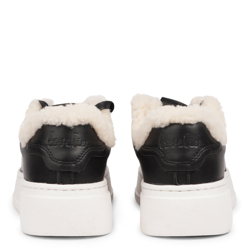Lovelies Studio Elevate your sneaker game with the Zanja low sneaker, a true embodiment of comfort and style. Crafted to keep you not only fashion-forward but also snug and cozy.
At the foundation of the Zanja low sneaker lies a soft yet durable rubber sole, ensuring long-lasting wear and exceptional grip.
The upper is adorned with leather and features charming shearling details, adding a touch of luxury to your every step. Whether you're dressing up for a night out or aiming for a more casual look, these