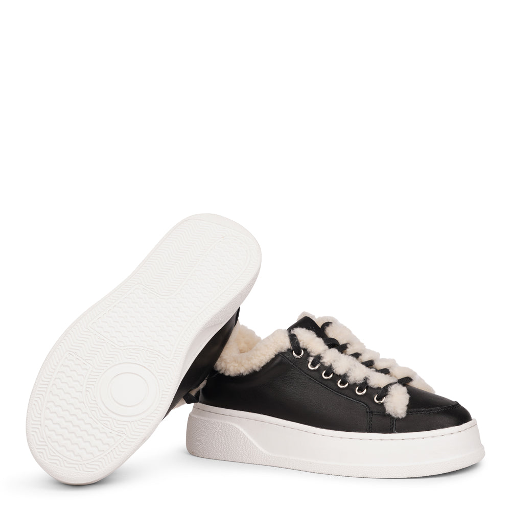 Lovelies Studio Elevate your sneaker game with the Zanja low sneaker, a true embodiment of comfort and style. Crafted to keep you not only fashion-forward but also snug and cozy.
At the foundation of the Zanja low sneaker lies a soft yet durable rubber sole, ensuring long-lasting wear and exceptional grip.
The upper is adorned with leather and features charming shearling details, adding a touch of luxury to your every step. Whether you're dressing up for a night out or aiming for a more casual look, these
