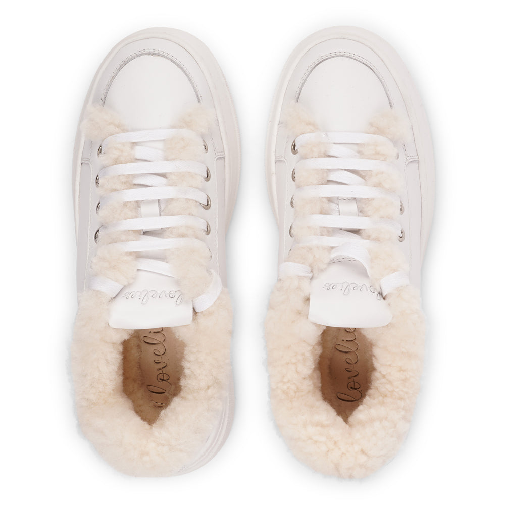 Lovelies Studio Elevate your sneaker game with the Zanja low sneaker, a true embodiment of comfort and style. Crafted to keep you not only fashion-forward but also snug and cozy.
At the foundation of the Zanja low sneaker lies a soft yet durable rubber sole, ensuring long-lasting wear and exceptional grip.
The upper is adorned with leather and features charming shearling details, adding a touch of luxury to your every step. Whether you're dressing up for a night out or aiming for a more casual look, these