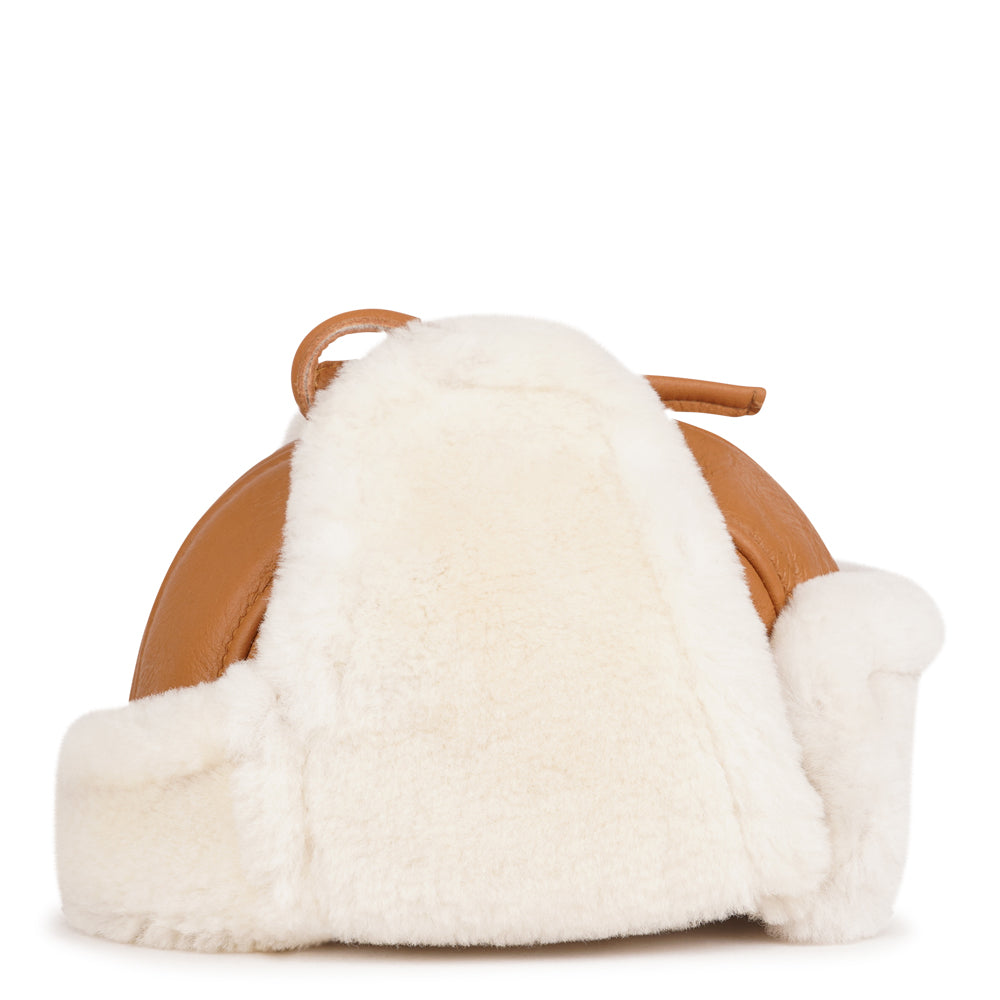 Lovelies Studio - Denmark - The unique design of the Zhuomala One Side Shearling Hat features a one-sided shearling construction, ensuring both warmth and a distinctive flair. The natural insulating properties of Australian sheepskin make this hat a reliable companion against the winter chill, providing a cocoon of coziness for your head and ears.