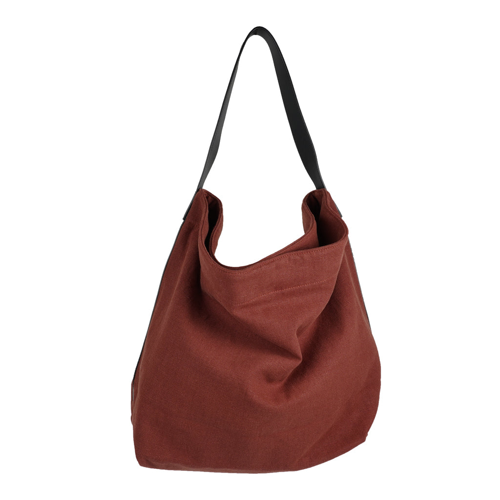 Our Lovelies casual shoulder shopper bag is made of high quality linen and a soft 100% leather handle. The bag has a large primary compartment in which you can fit in all of your stuff when you're on the go.    Inside the shopper bag there's a magnetic button closure at the top as well as a  phone pocket.  60% Linen & 40% Cotton   Double Lining   100% Leather handle  Inside phone pocket  Size H41 x W52 x D20 cm