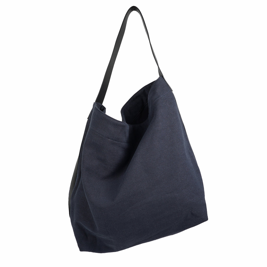 Our Lovelies casual shoulder shopper bag is made of high quality linen and a soft 100% leather handle. The bag has a large primary compartment in which you can fit in all of your stuff when you're on the go.    Inside the shopper bag there's a magnetic button closure at the top as well as a  phone pocket.  60% Linen & 40% Cotton   Double Lining   100% Leather handle  Inside phone pocket  Size H41 x W52 x D20 cm