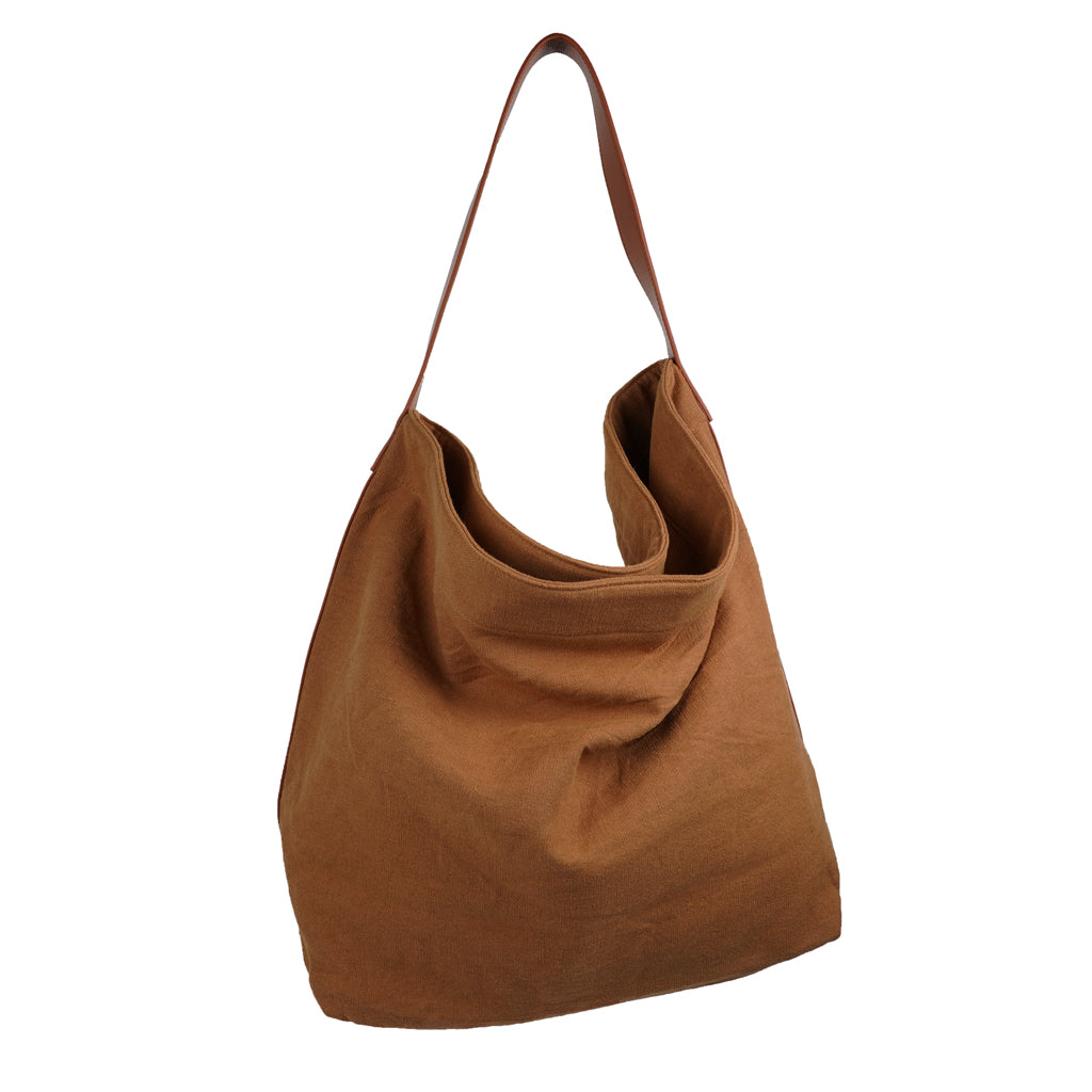 Our Lovelies casual shoulder shopper bag is made of high quality linen and a soft 100% leather handle. The bag has a large primary compartment in which you can fit in all of your stuff when you're on the go.    Inside the shopper bag there's a magnetic button closure at the top as well as a  phone pocket.  60% Linen & 40% Cotton   Double Lining   100% Leather handle  Inside phone pocket  Size H41 x W52 x D20 cm