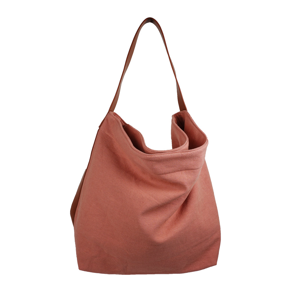 Our Lovelies casual shoulder shopper bag is made of high quality linen and a soft 100% leather handle. The bag has a large primary compartment in which you can fit in all of your stuff when you're on the go.    Inside the shopper bag there's a magnetic button closure at the top as well as a  phone pocket.  60% Linen & 40% Cotton   Double Lining   100% Leather handle  Inside phone pocket  Size H41 x W52 x D20 cm