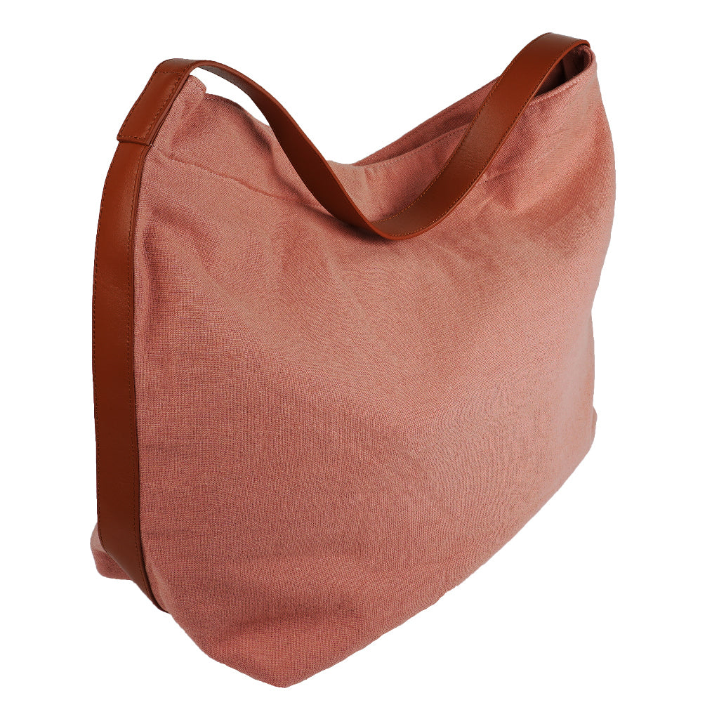 Our Lovelies casual shoulder shopper bag is made of high quality linen and a soft 100% leather handle. The bag has a large primary compartment in which you can fit in all of your stuff when you're on the go.    Inside the shopper bag there's a magnetic button closure at the top as well as a  phone pocket.  60% Linen & 40% Cotton   Double Lining   100% Leather handle  Inside phone pocket  Size H41 x W52 x D20 cm