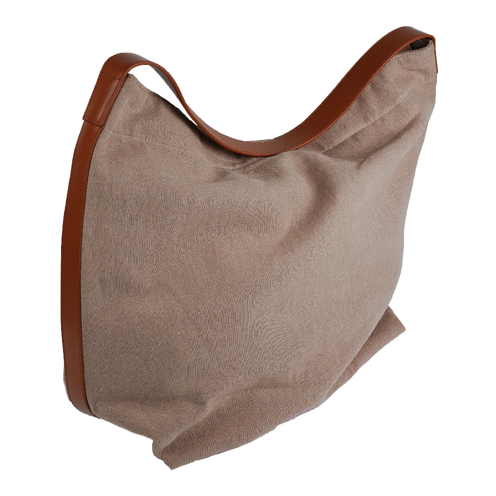 Our Lovelies casual shoulder shopper bag is made of high quality linen and a soft 100% leather handle. The bag has a large primary compartment in which you can fit in all of your stuff when you're on the go. Inside the shopper bag there's a magnetic button closure at the top as well as a phone pocket. 60% Linen & 40% Cotton Double Lining 100% Leather handle Inside phone pocket Size H41 x W52 x D20 cm