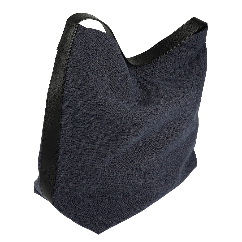 Our Lovelies casual shoulder shopper bag is made of high quality linen and a soft 100% leather handle. The bag has a large primary compartment in which you can fit in all of your stuff when you're on the go.    Inside the shopper bag there's a magnetic button closure at the top as well as a  phone pocket.  60% Linen & 40% Cotton   Double Lining   100% Leather handle  Inside phone pocket  Size H41 x W52 x D20 cm