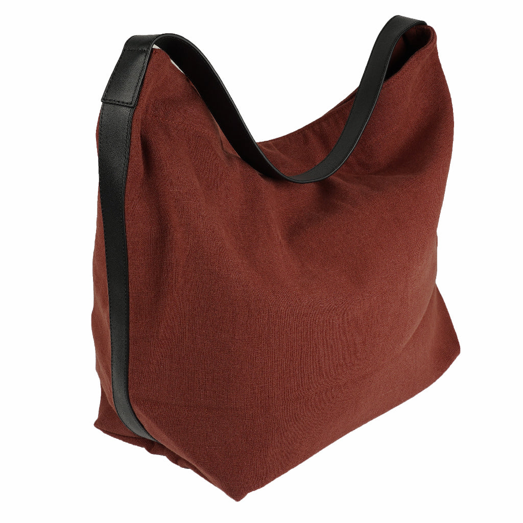 Our Lovelies casual shoulder shopper bag is made of high quality linen and a soft 100% leather handle. The bag has a large primary compartment in which you can fit in all of your stuff when you're on the go. Inside the shopper bag there's a magnetic button closure at the top as well as a phone pocket. 60% Linen & 40% Cotton Double Lining 100% Leather handle Inside phone pocket Size H41 x W52 x D20 cm